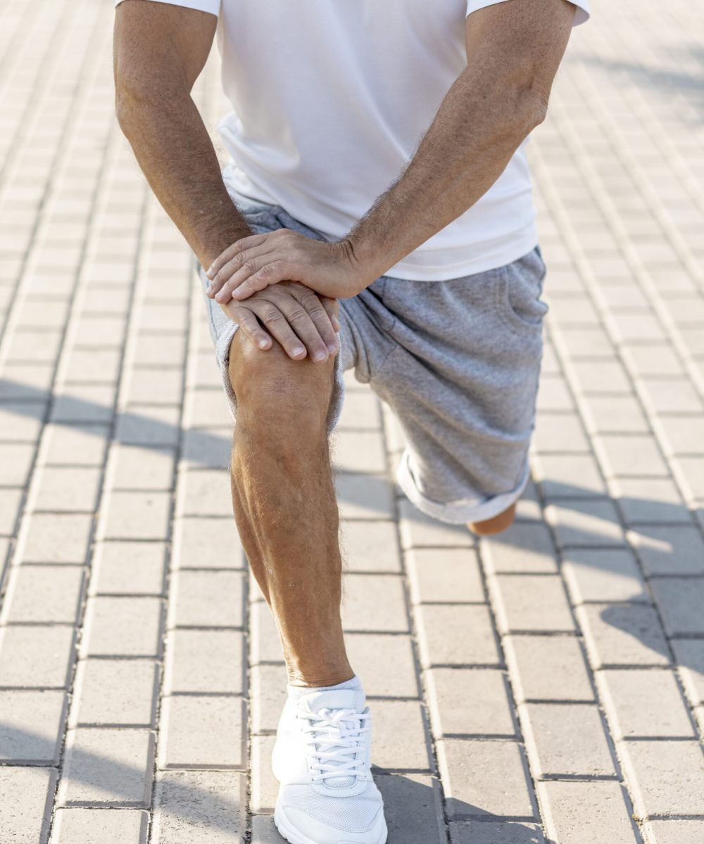 elder-man-stretching-sidewalk